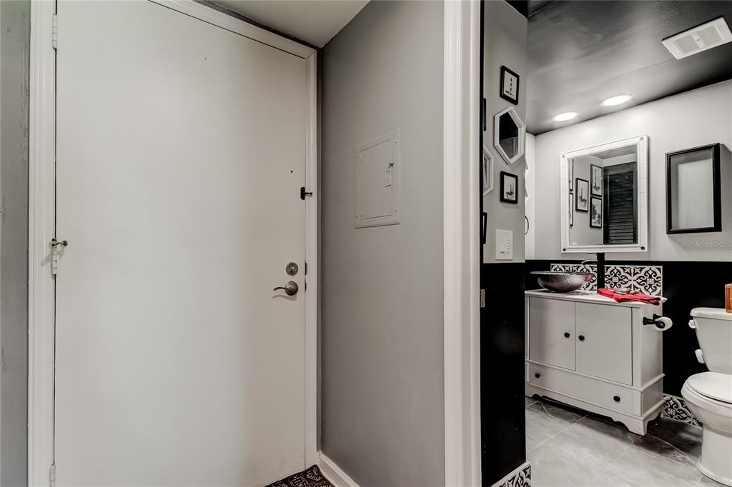 4775 Cove Circle, Unit 1105 St. Petersburg, FL 33708 - Photo 8 of 40 a room with storage and utility