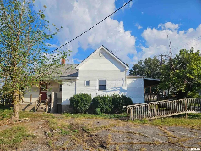 a house view with a garden space