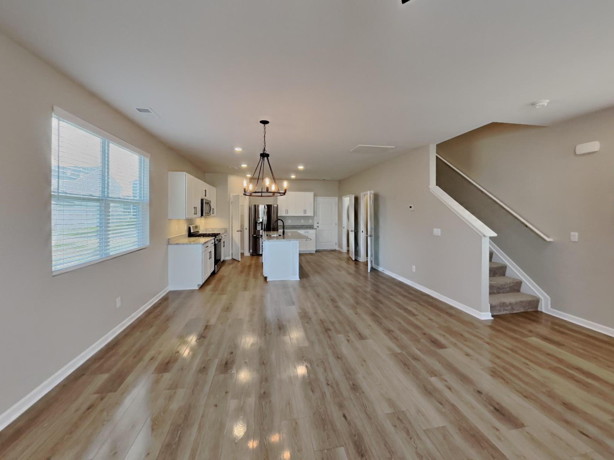 1406 Ashfield Place Lebanon, TN 37087 - Photo 2 of 17 a view of empty room with wooden floor and fan