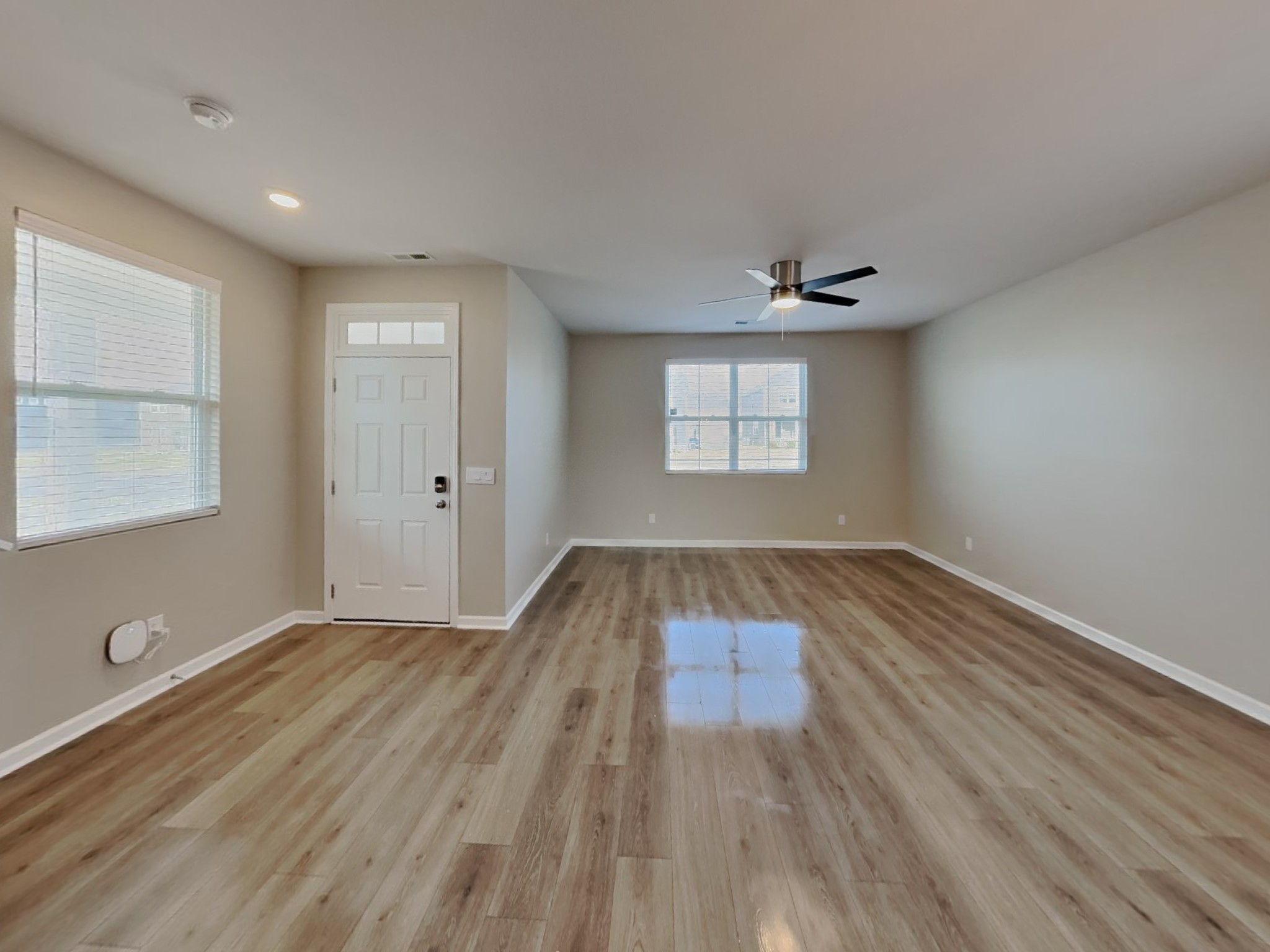 1406 Ashfield Place Lebanon, TN 37087 - Photo 3 of 17 an empty room with wooden floor and windows