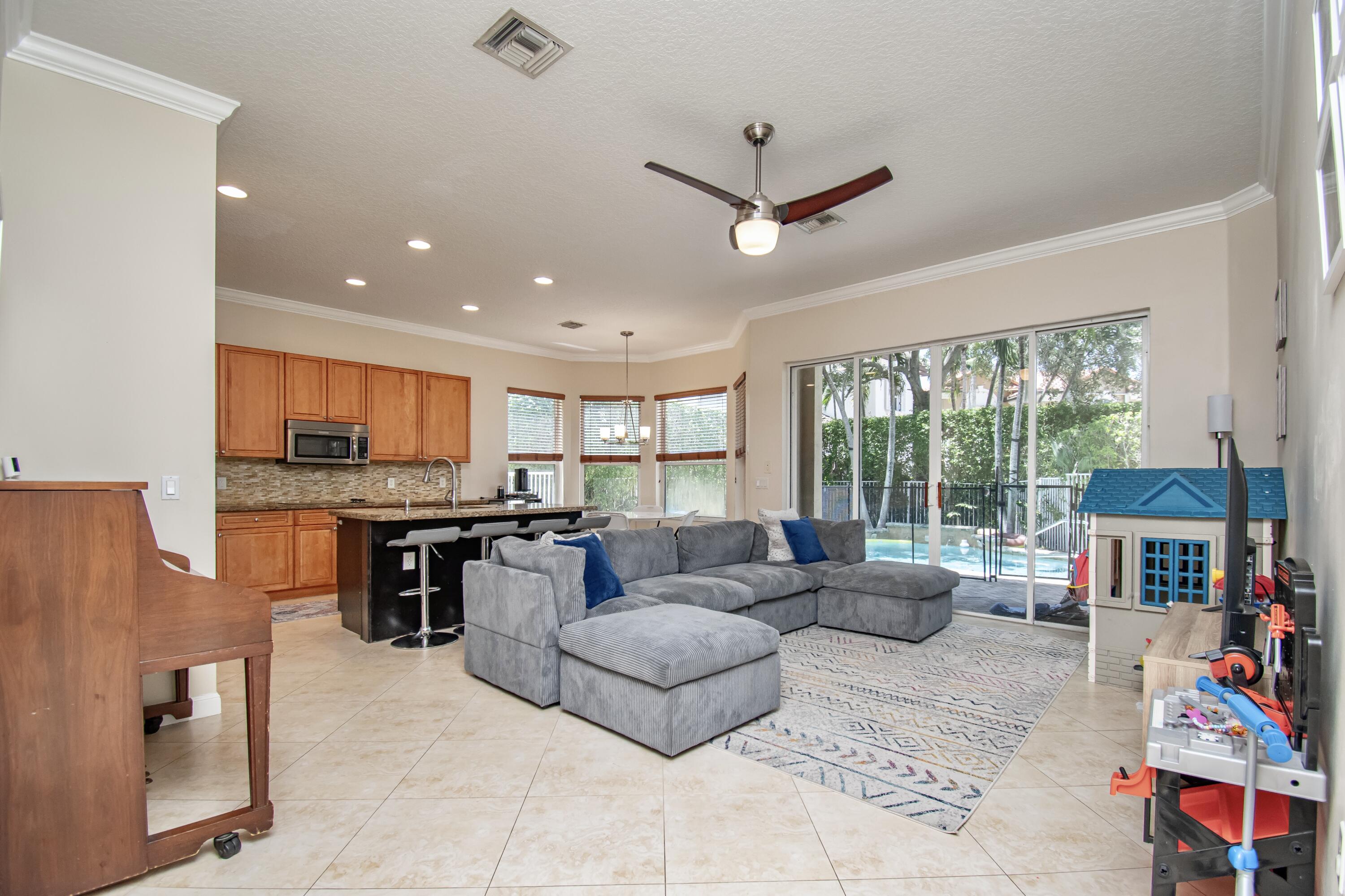 9851 Palma Vista Way Boca Raton, FL 33428 - Photo 11 of 33 a living room with furniture and a large window