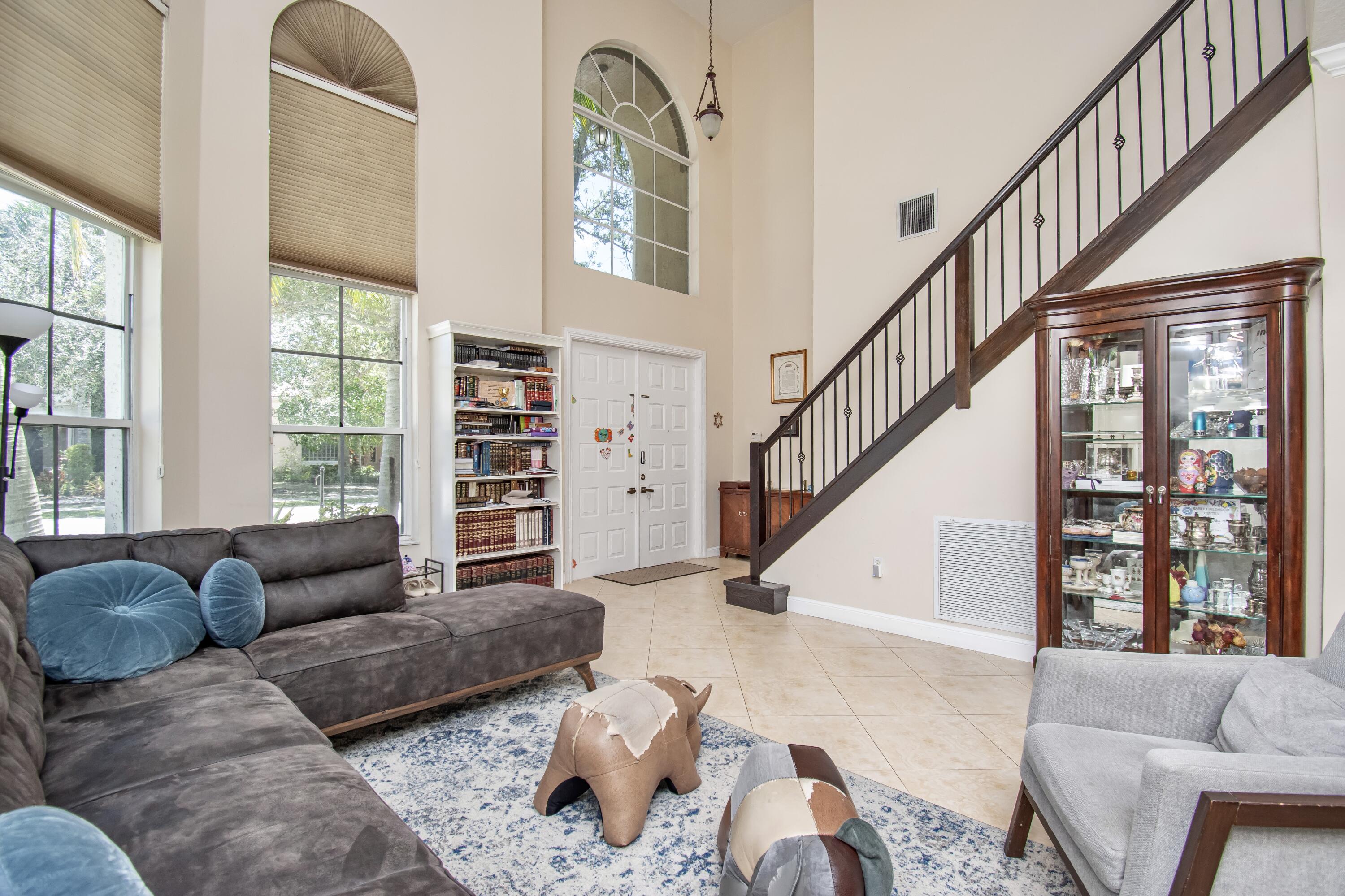 9851 Palma Vista Way Boca Raton, FL 33428 - Photo 6 of 33 a living room with furniture and a large window
