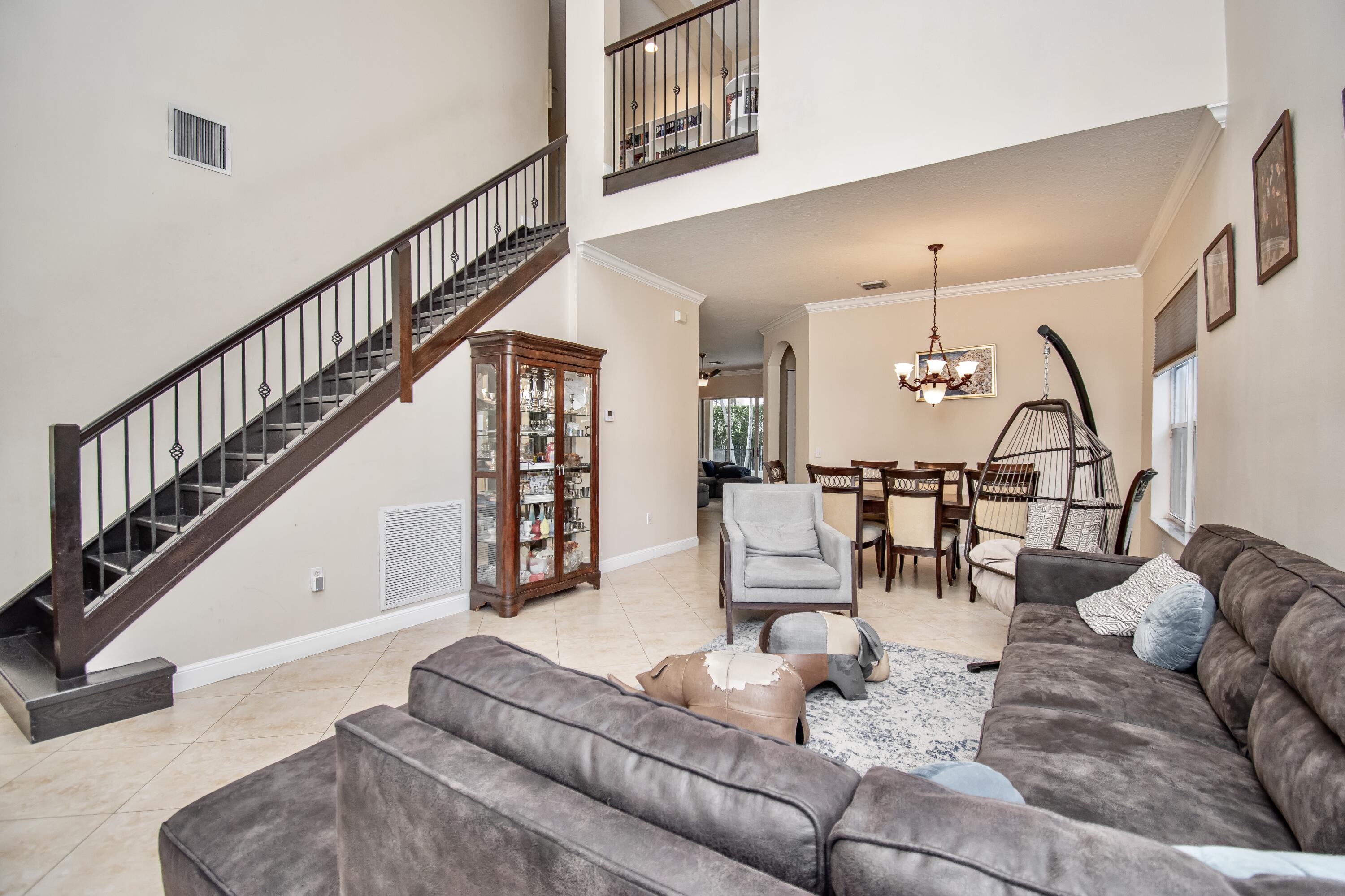 9851 Palma Vista Way Boca Raton, FL 33428 - Photo 9 of 33 a living room with furniture and wooden floor