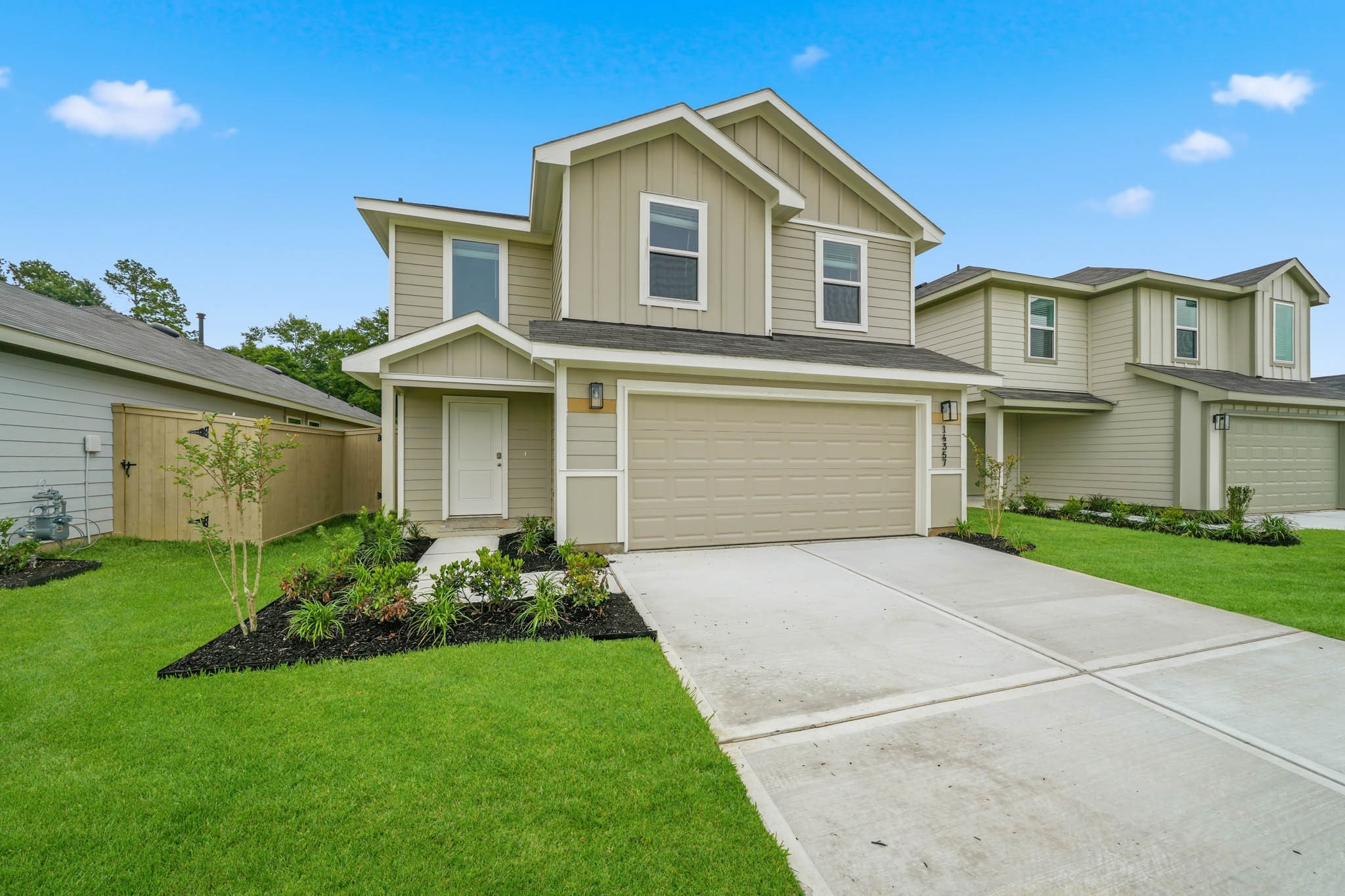 front view of a house with a yard