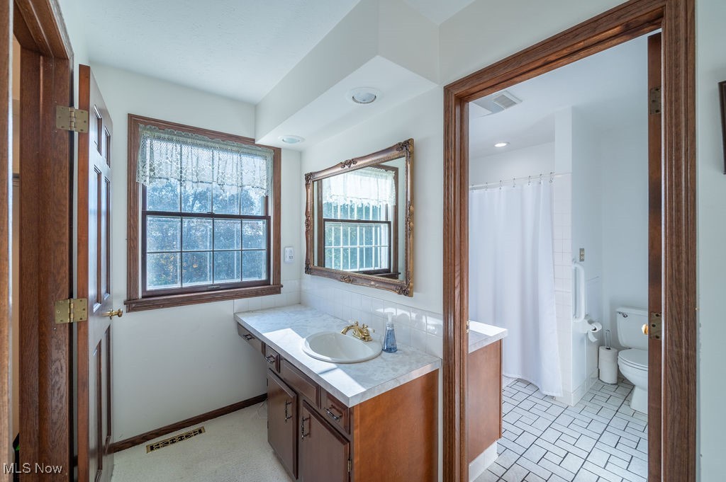 1252 New England Ridge Road Washington, WV 26181 - Photo 24 of 50 Full bathroom featuring vanity and toilet