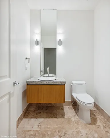 a bathroom with a toilet and a sink