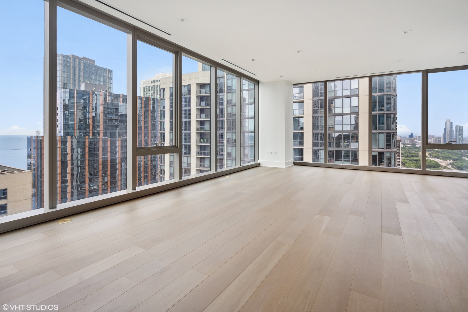 363 East Wacker Drive, Unit 2709 Chicago, IL 60601 - Photo 5 of 25 a view of an empty room with wooden floor and a window
