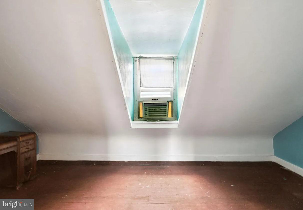 803 North 5th Street Philadelphia, PA 19123 - Photo 18 of 19 a view of an empty room with wooden floor and a window