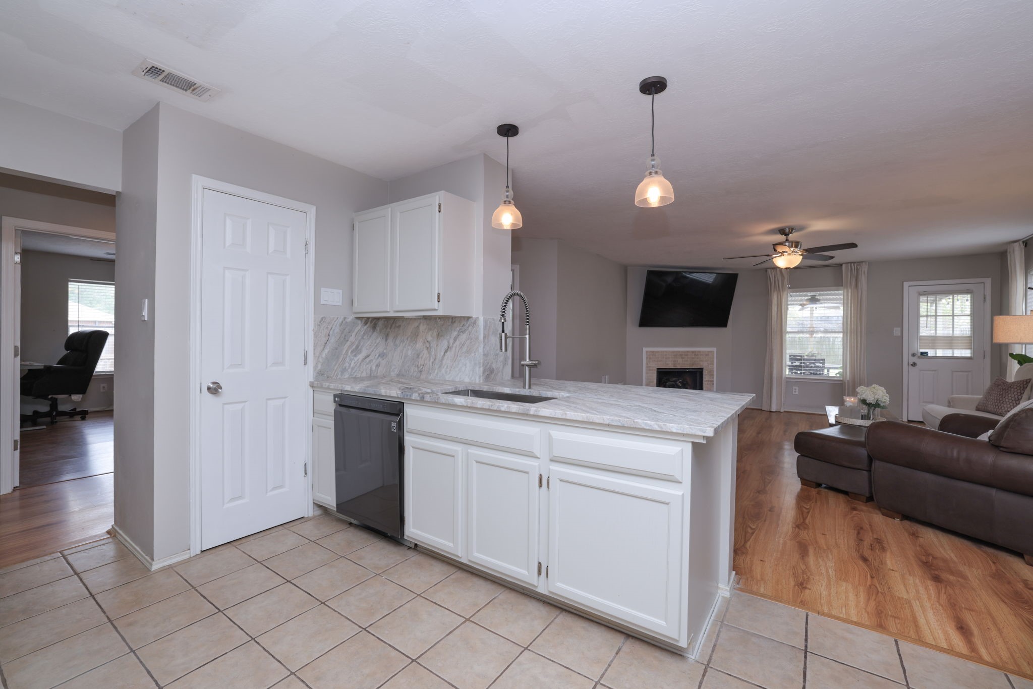 3803 Oaklace Drive Spring, TX 77389 - Photo 16 of 36 a kitchen with cabinets and chairs