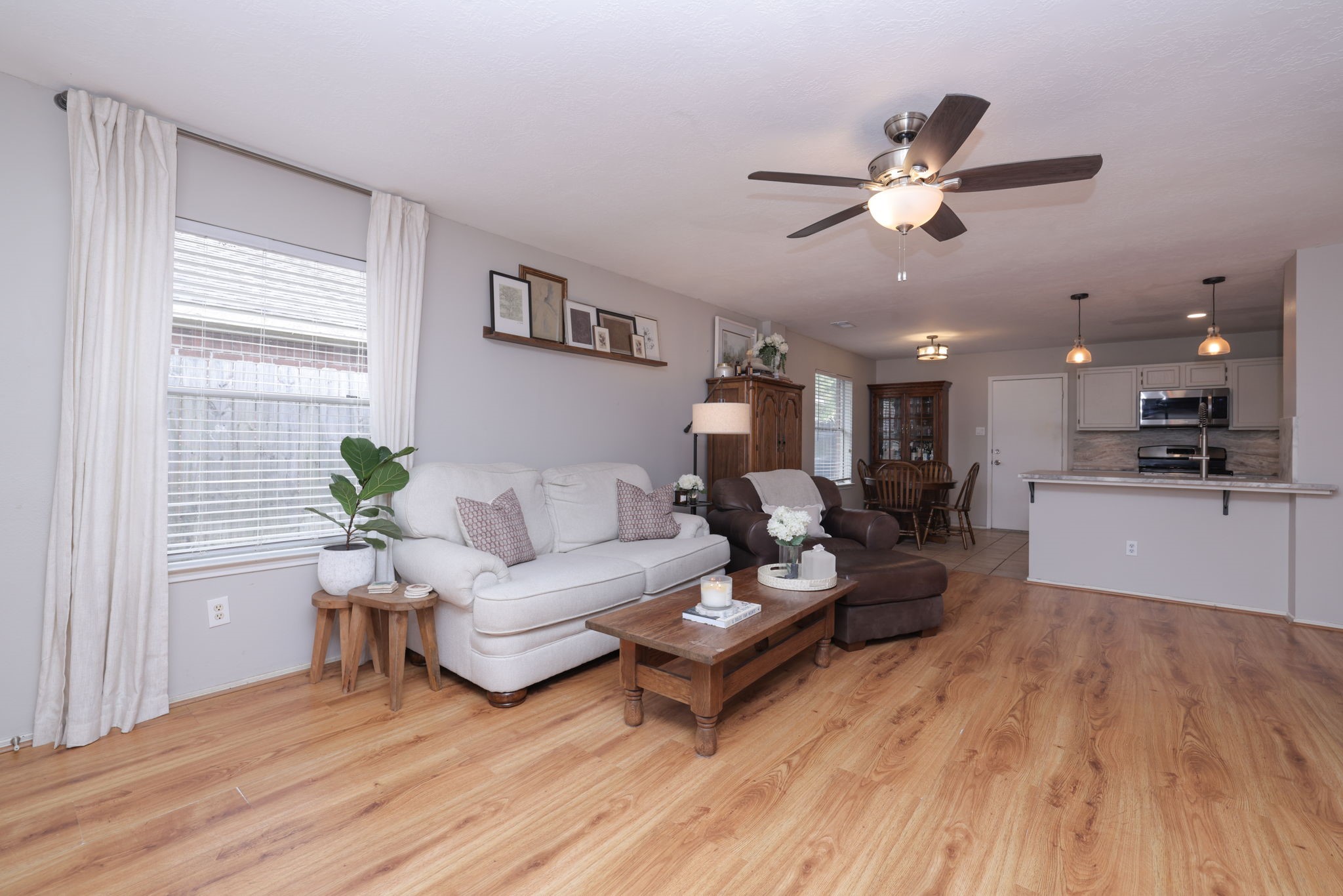 3803 Oaklace Drive Spring, TX 77389 - Photo 19 of 36 a living room with furniture and a wooden floor