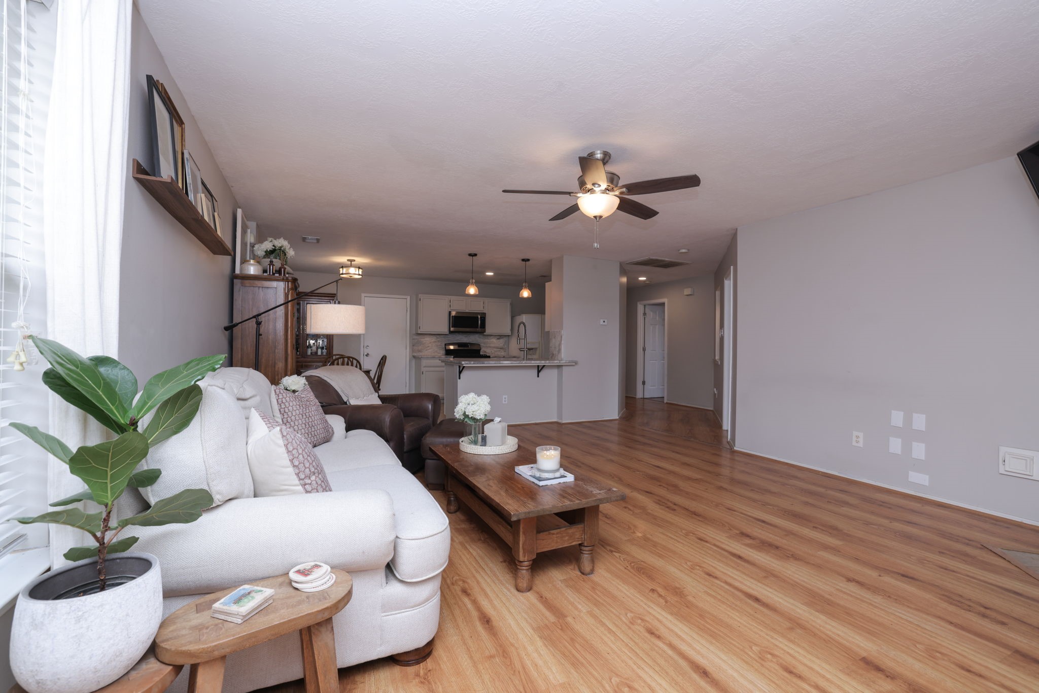 3803 Oaklace Drive Spring, TX 77389 - Photo 20 of 36 a living room with furniture and a wooden floor