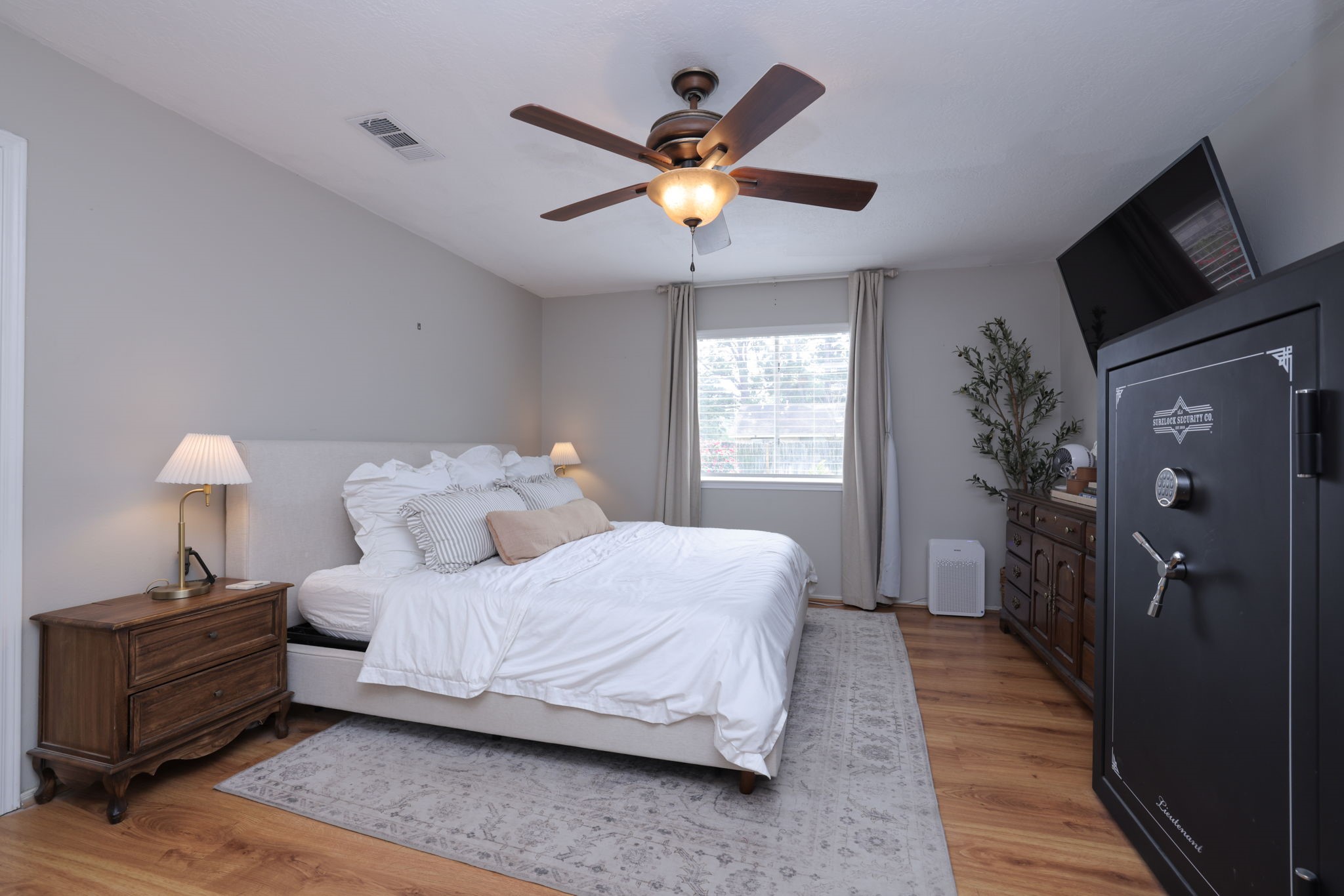 3803 Oaklace Drive Spring, TX 77389 - Photo 22 of 36 a bedroom with a bed and a chandelier
