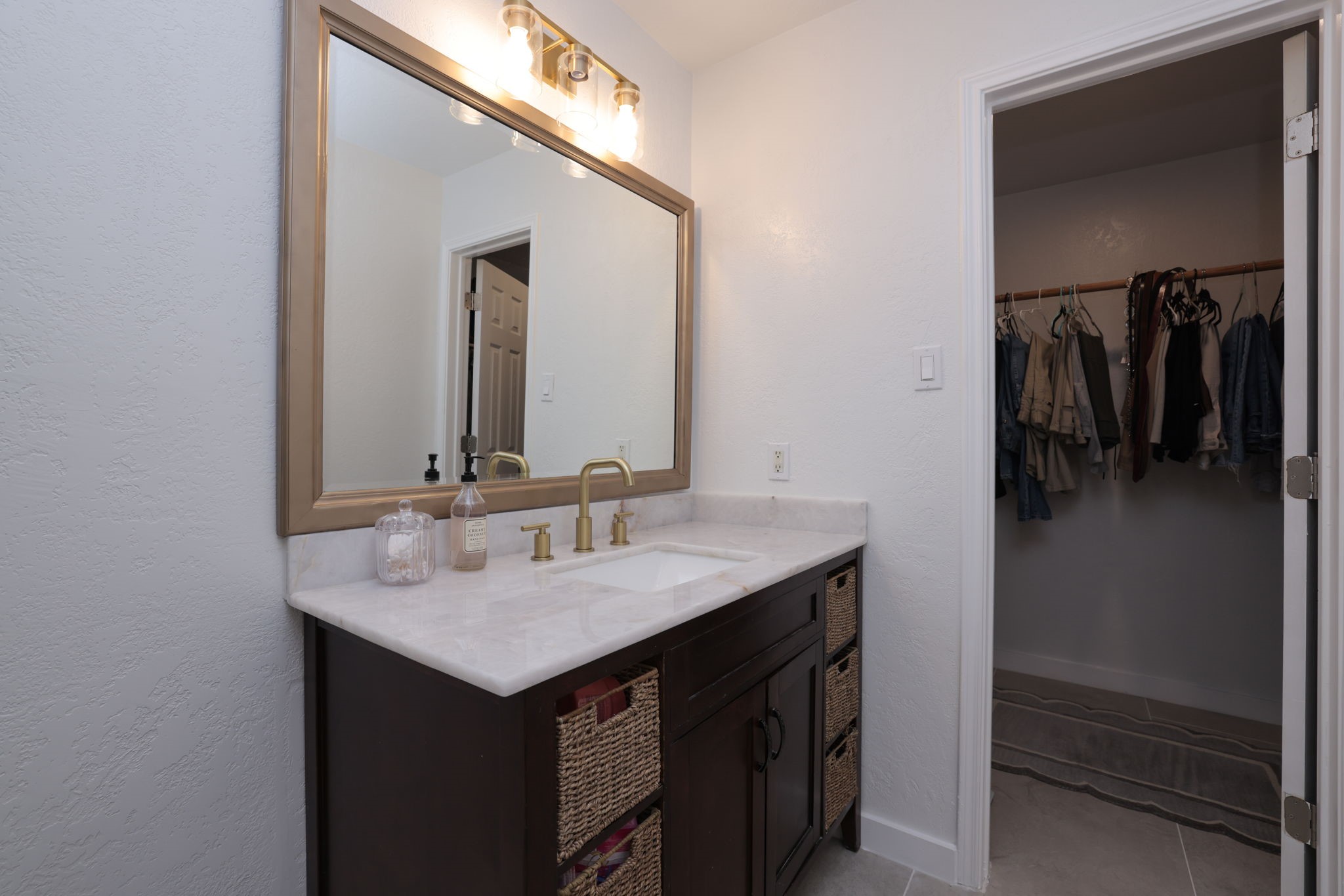 3803 Oaklace Drive Spring, TX 77389 - Photo 25 of 36 a bathroom with a sink and a mirror