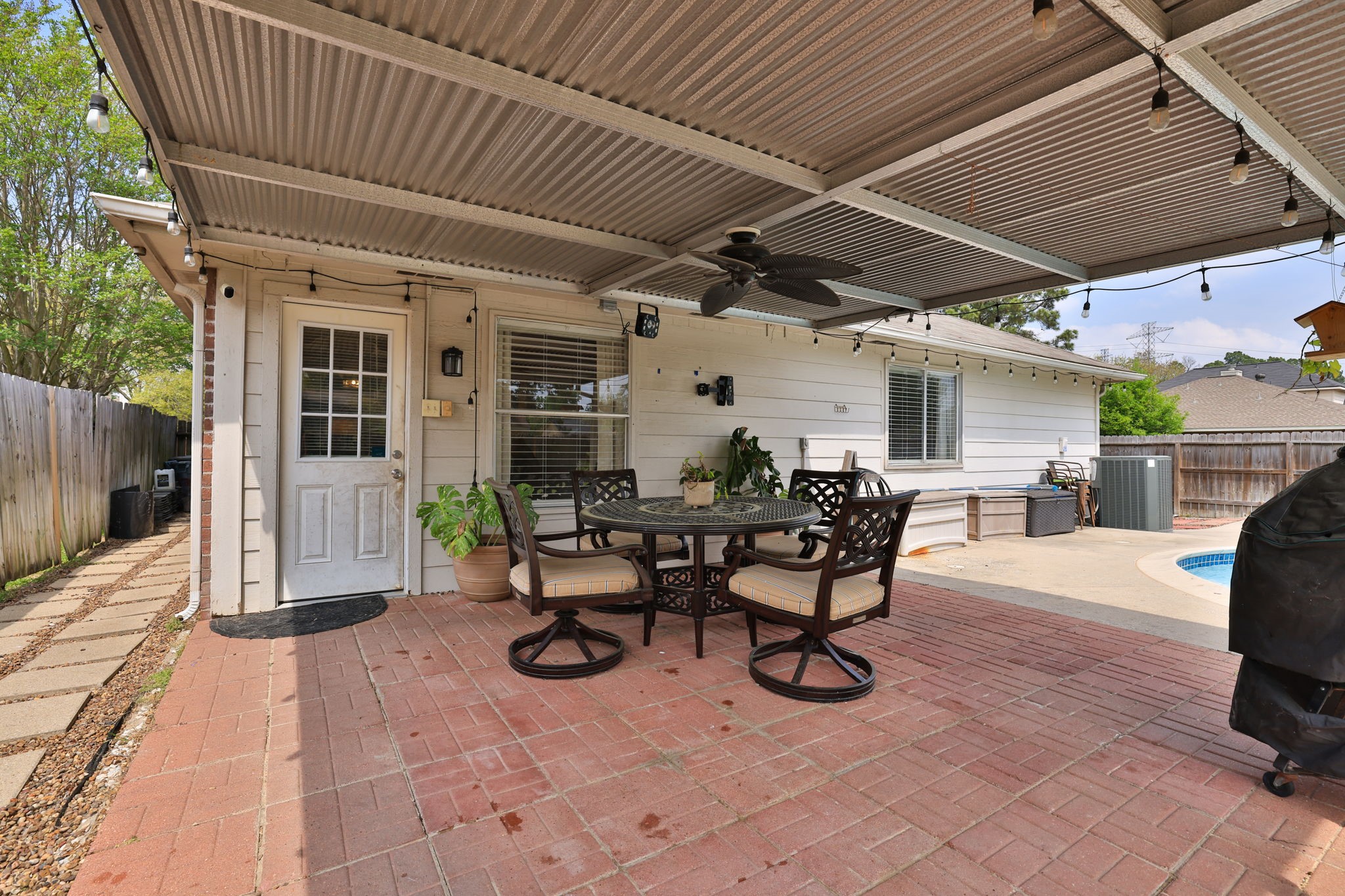 3803 Oaklace Drive Spring, TX 77389 - Photo 27 of 36 a view of a patio with table and chairs and potted plants
