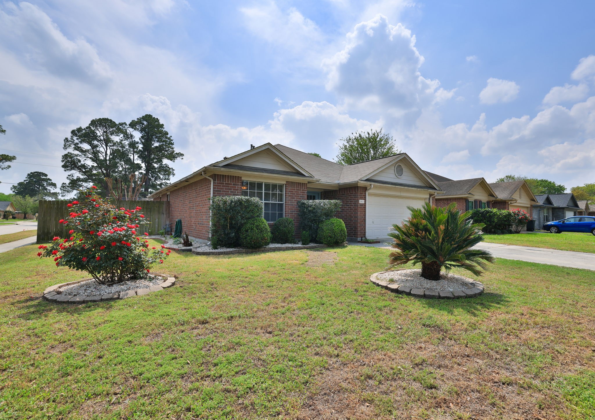 3803 Oaklace Drive Spring, TX 77389 - Photo 3 of 36 a front view of a house with a yard and garage