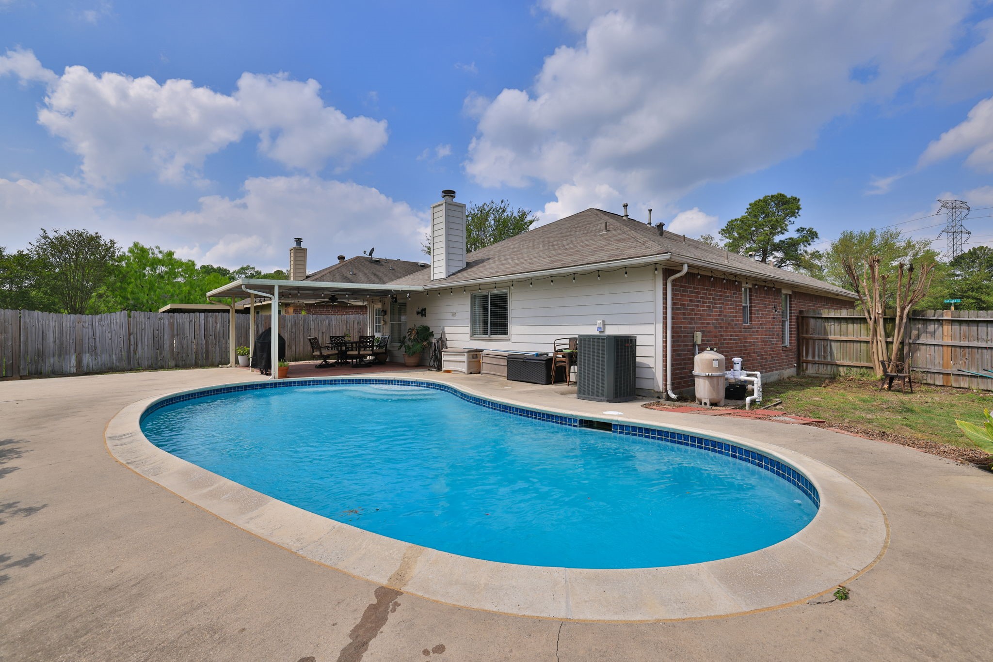 3803 Oaklace Drive Spring, TX 77389 - Photo 32 of 36 a view of a swimming pool with a patio