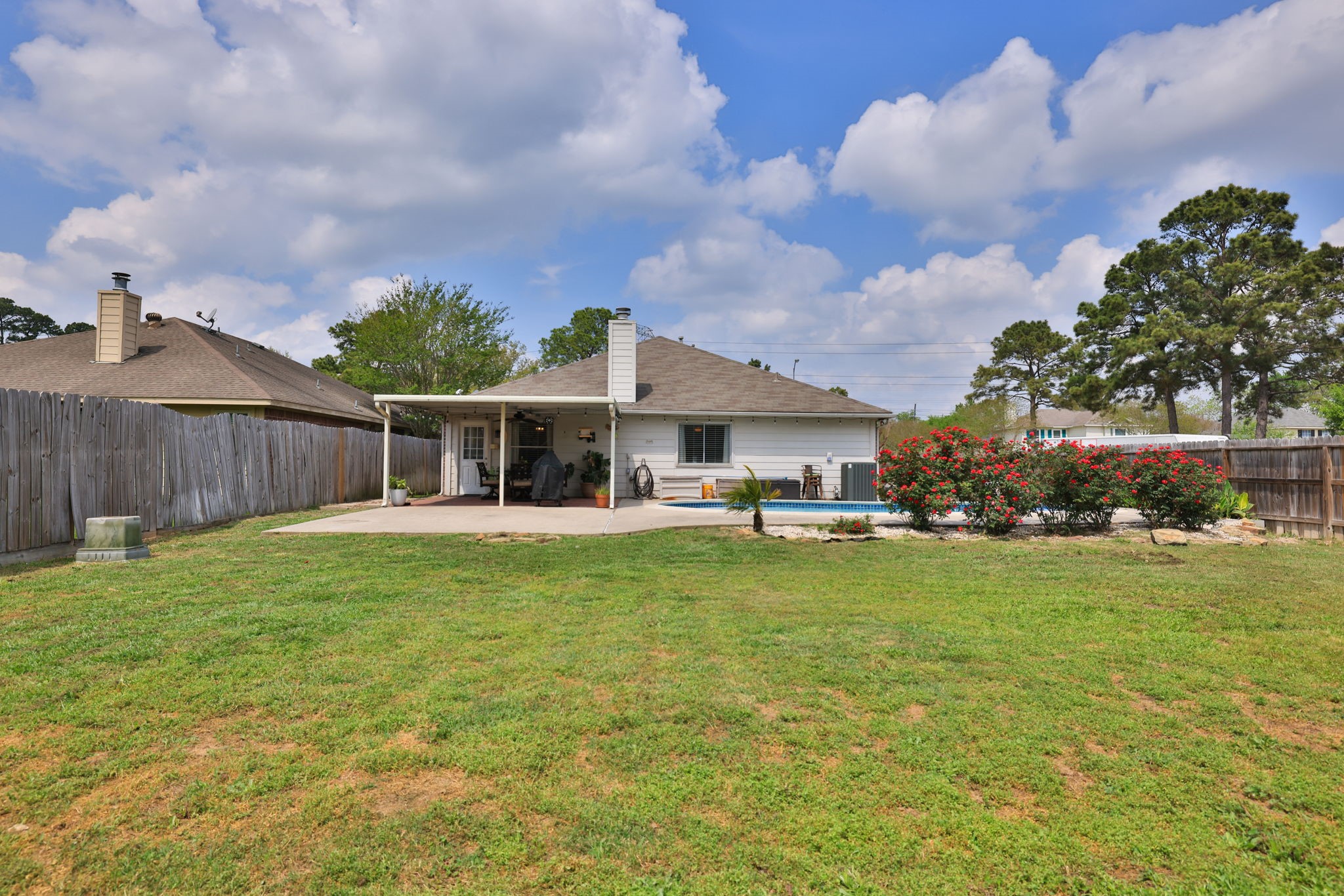 3803 Oaklace Drive Spring, TX 77389 - Photo 35 of 36 a backyard of a house with table and chairs
