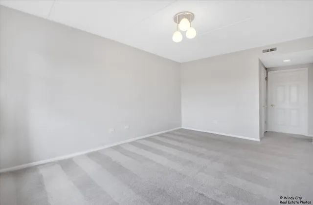 a view of room with window and ceiling fan