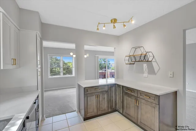 a kitchen with a sink and cabinets