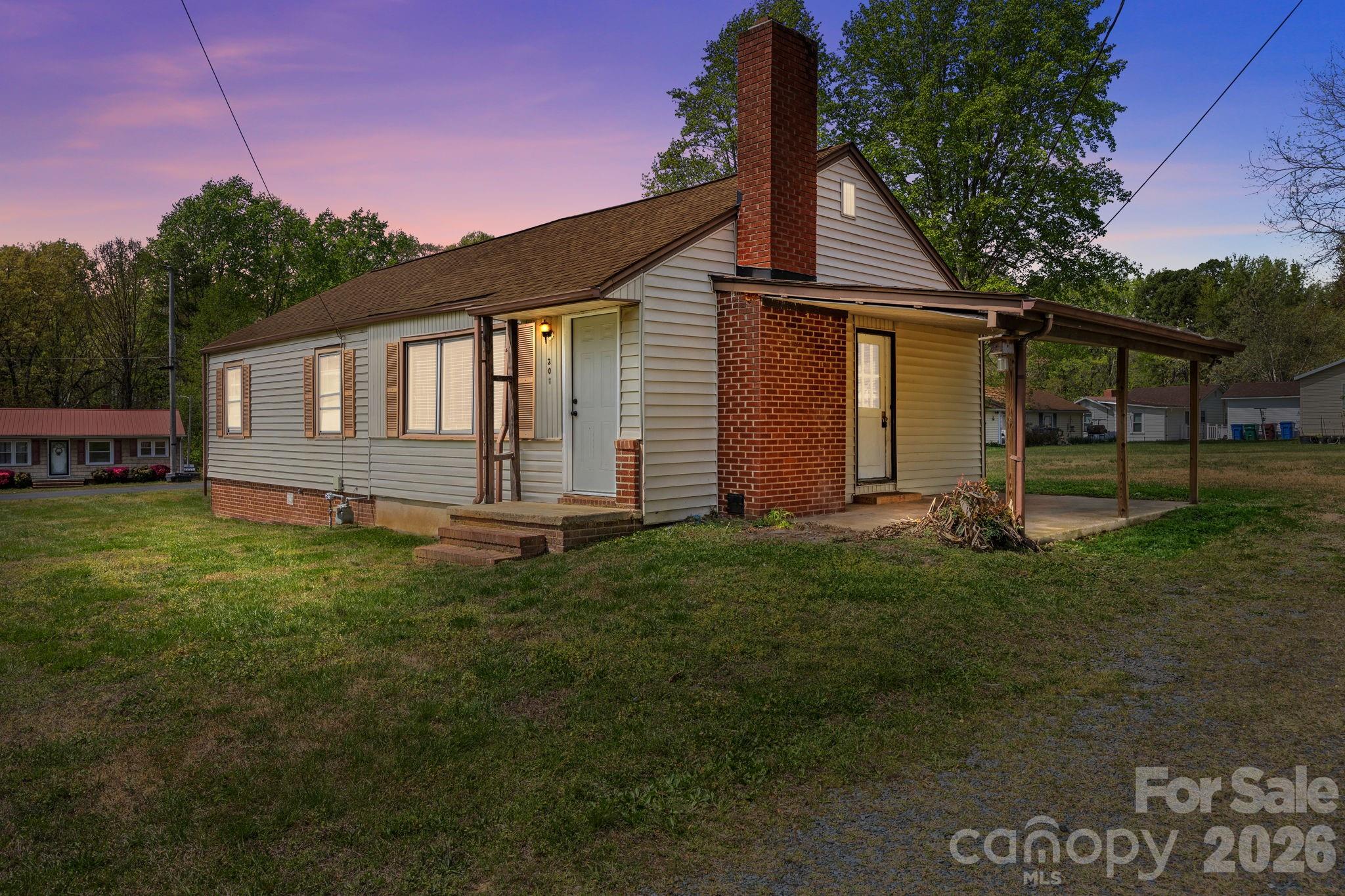 208 Ellis Street Albemarle, NC 28001 - Photo 1 of 38 a backyard of a house with lots of green space