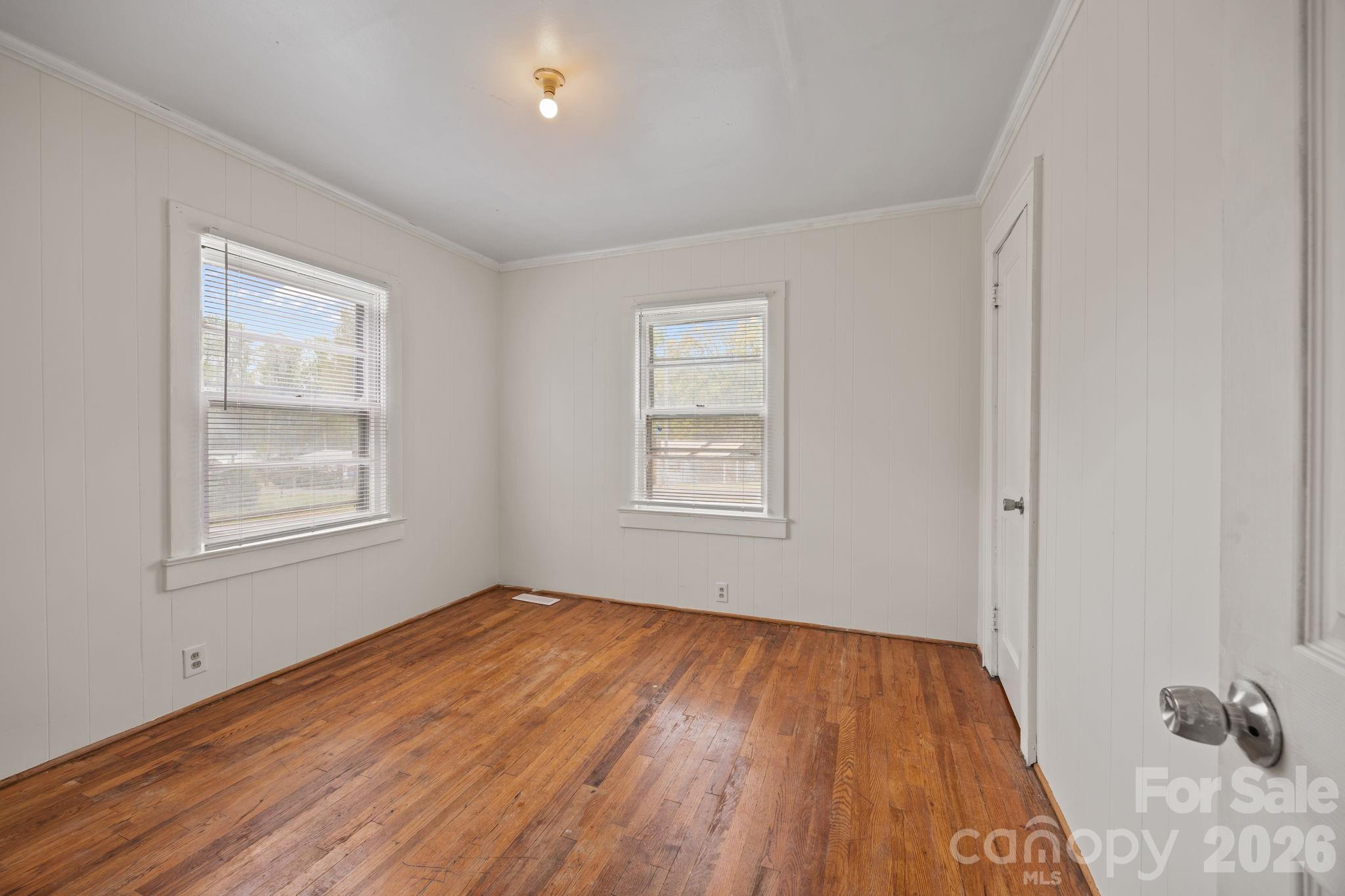 208 Ellis Street Albemarle, NC 28001 - Photo 18 of 38 a view of a room with wooden floor and windows