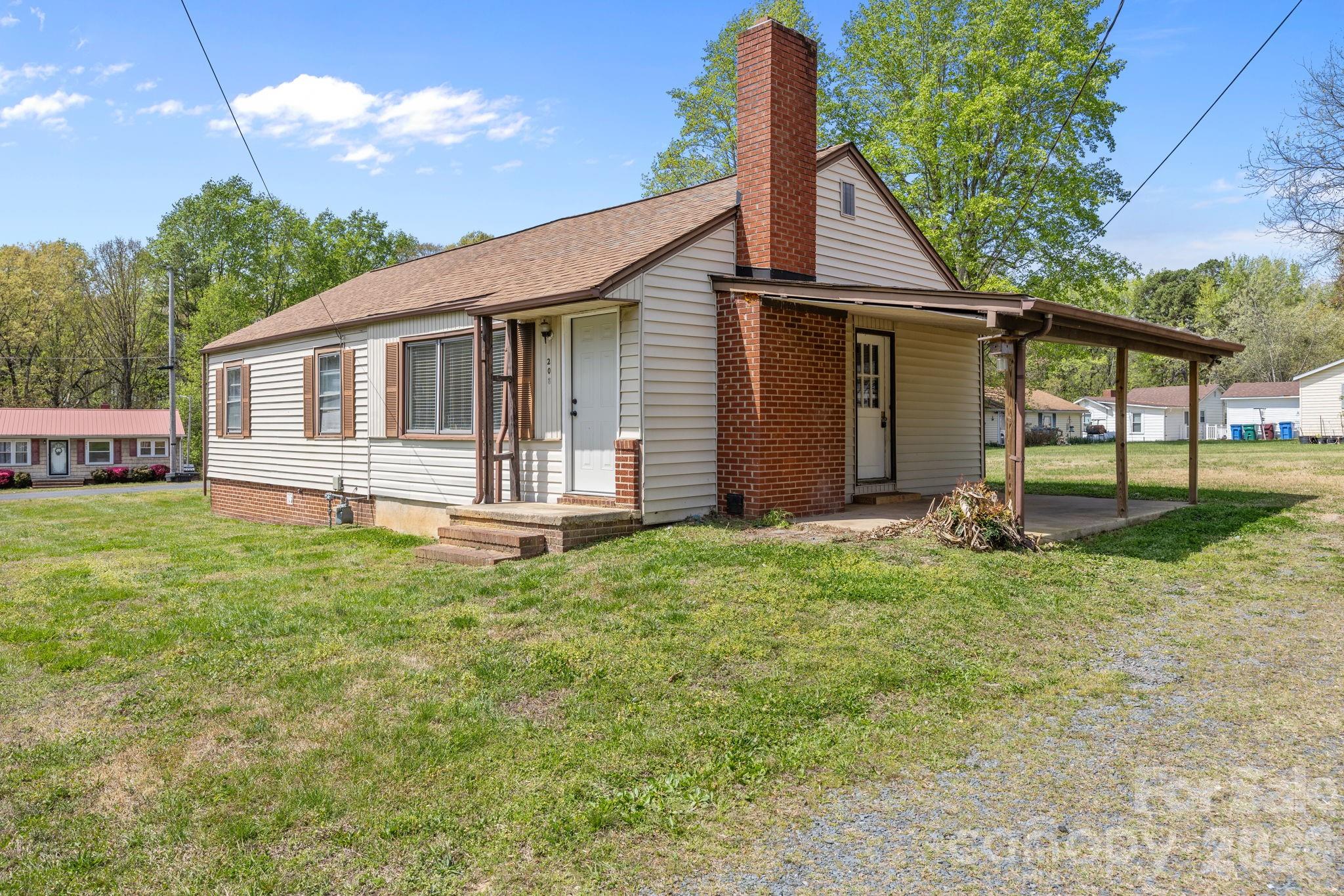 208 Ellis Street Albemarle, NC 28001 - Photo 2 of 38 a view of a house with backyard