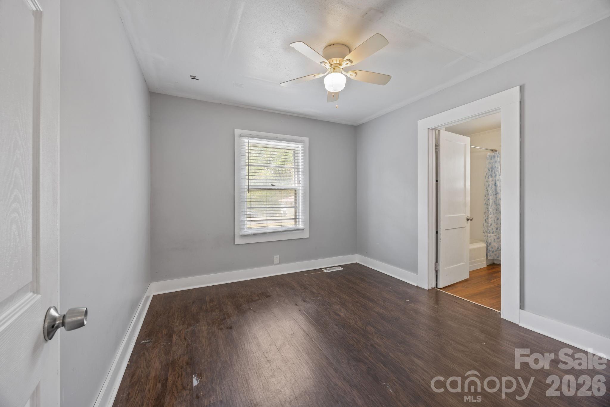 208 Ellis Street Albemarle, NC 28001 - Photo 21 of 38 wooden floor in an empty room with a window