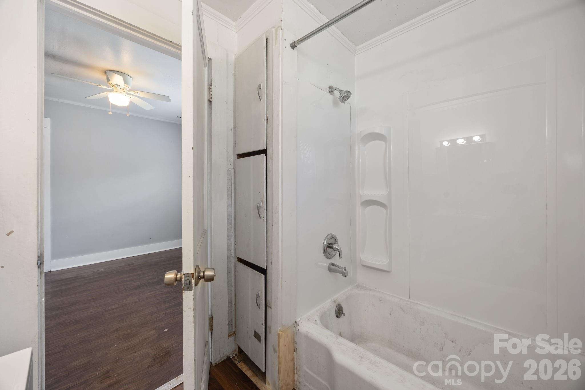 208 Ellis Street Albemarle, NC 28001 - Photo 25 of 38 a bathroom with a bathtub and a shower