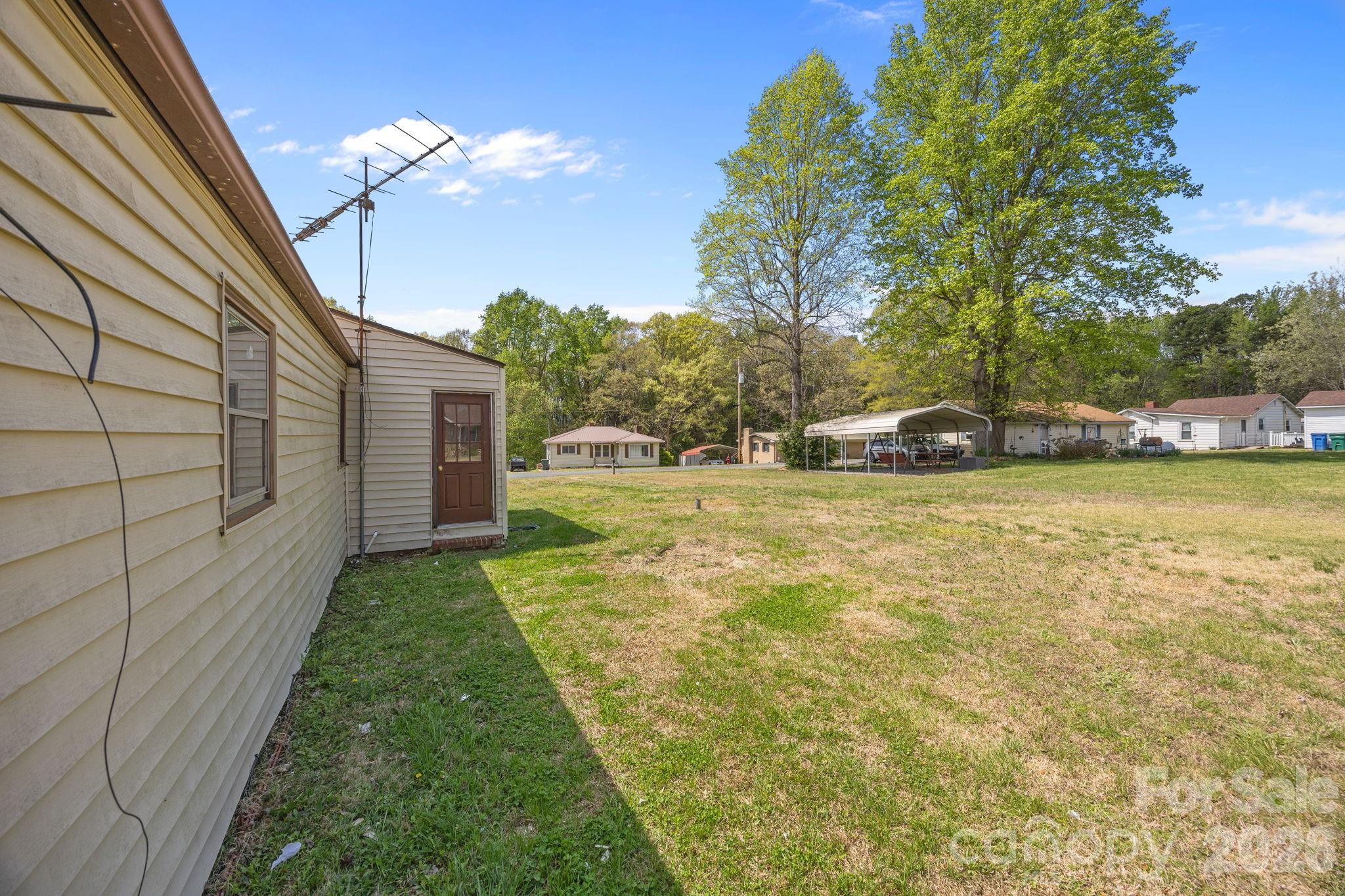 208 Ellis Street Albemarle, NC 28001 - Photo 27 of 38 a view of yard with swimming pool and sitting area