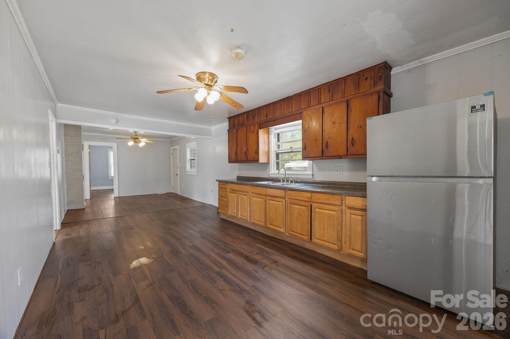 208 Ellis Street Albemarle, NC 28001 - Photo 10 of 38 a kitchen with a refrigerator a sink and dishwasher
