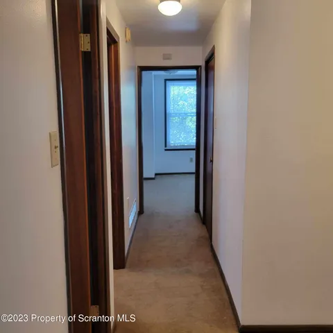 a view of a hallway with closet