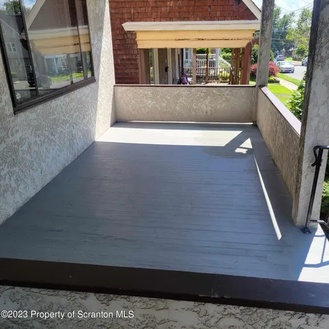 a view of a living room with a large window