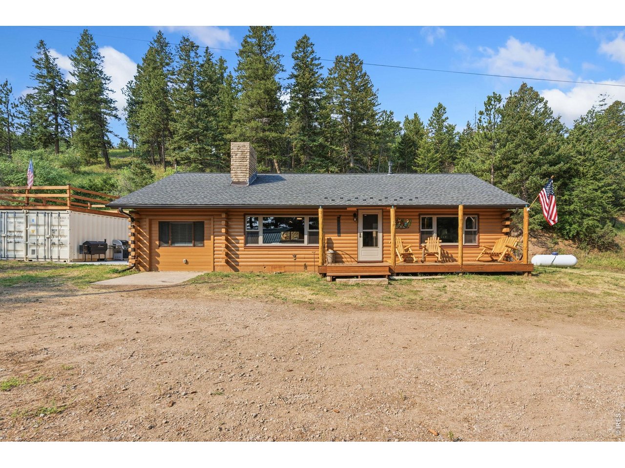 12743 Rist Canyon Road Bellvue, CO 80512 - Photo 47 of 49 a front view of a house with a garden