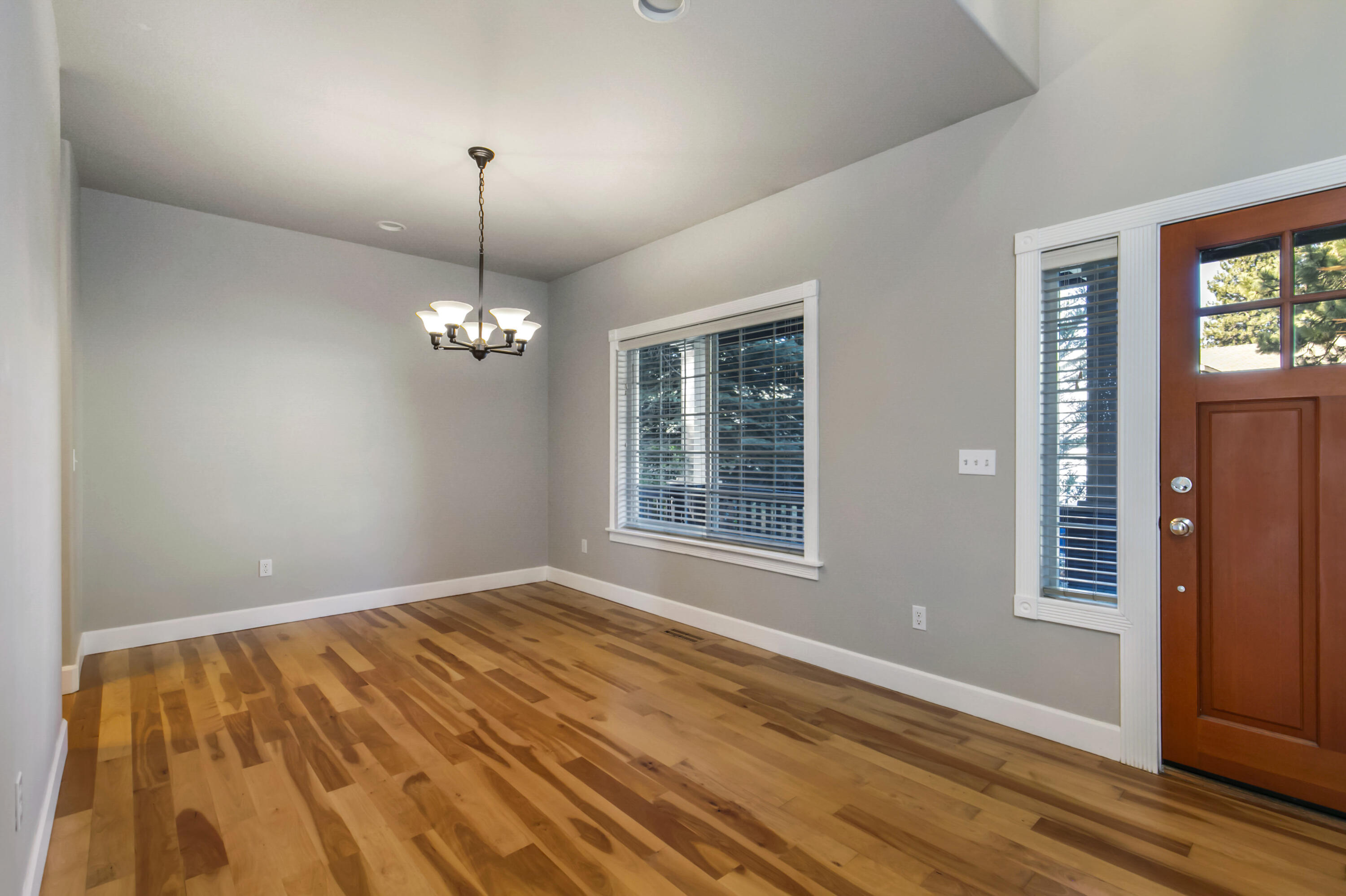 61302 Southwest Brookside Loop Bend, OR 97702 - Photo 2 of 22 Hardwood floors in the dining room off of the entry.