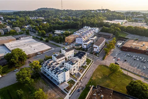 an aerial view of a house with a garden