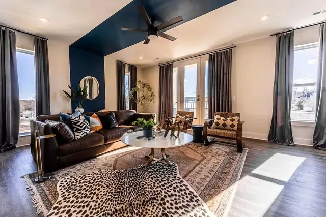 a living room with furniture and a large window