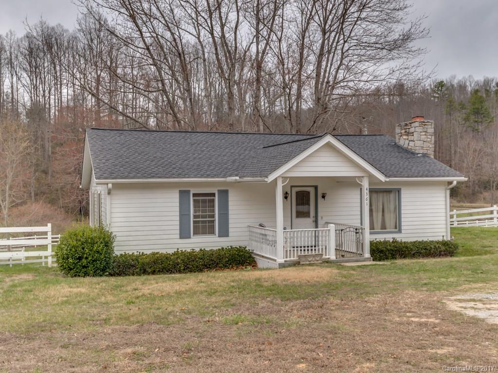 4361 Chimney Rock Road Hendersonville, NC 28792 - Photo 1 of 19 a view of a house with a yard