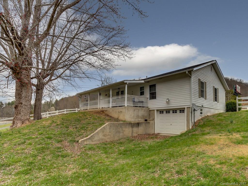 4361 Chimney Rock Road Hendersonville, NC 28792 - Photo 15 of 19 a view of a house with a yard