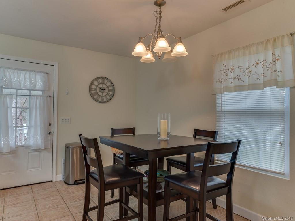 4361 Chimney Rock Road Hendersonville, NC 28792 - Photo 3 of 19 a view of a dining room with a table and chairs