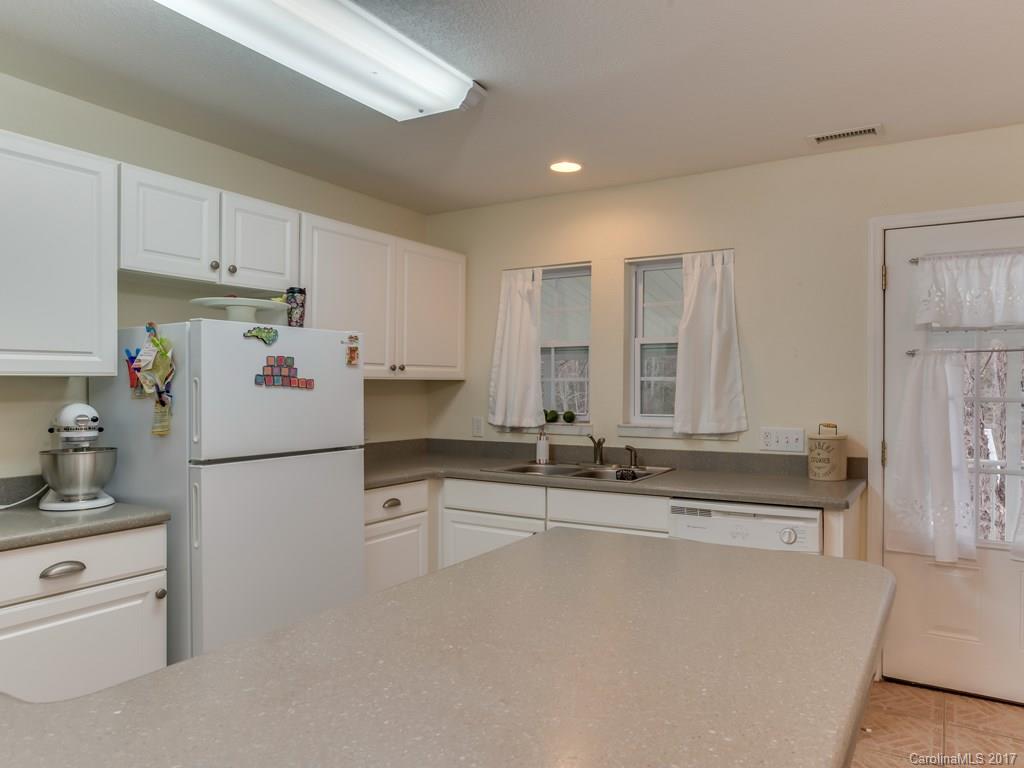 4361 Chimney Rock Road Hendersonville, NC 28792 - Photo 5 of 19 a kitchen with appliances a sink and cabinets