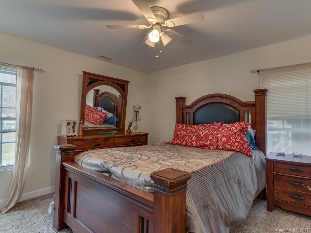 4361 Chimney Rock Road Hendersonville, NC 28792 - Photo 8 of 19 a bedroom with a bed and a dresser