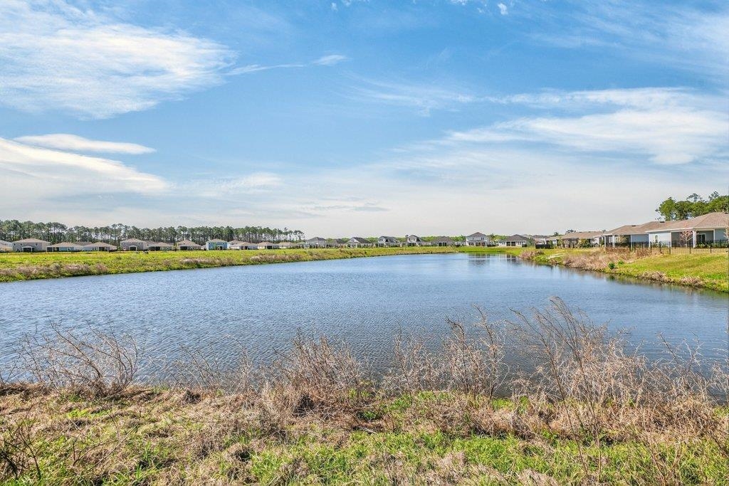 210 White Rabbit Run St. Augustine, FL 32092 - Photo 24 of 85 a view of a lake with houses in the back
