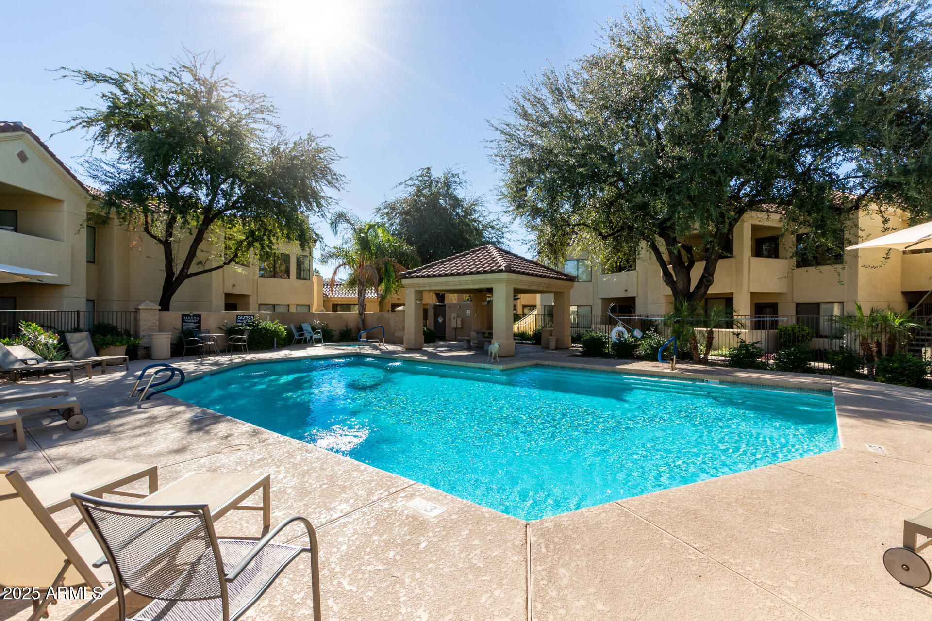 7575 East Indian Bend Road, Unit 2146 Scottsdale, AZ 85250 - Photo 21 of 40 a front view of a house with garden