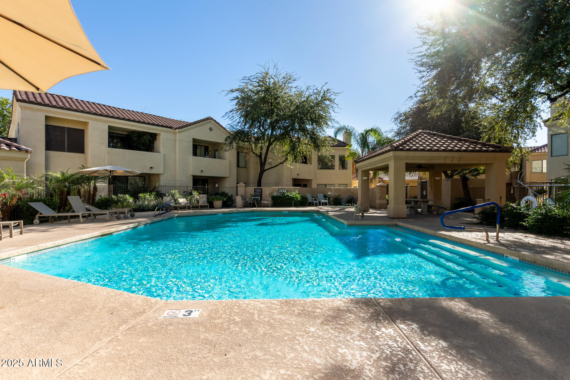 7575 East Indian Bend Road, Unit 2146 Scottsdale, AZ 85250 - Photo 26 of 40 a front view of a house with garden