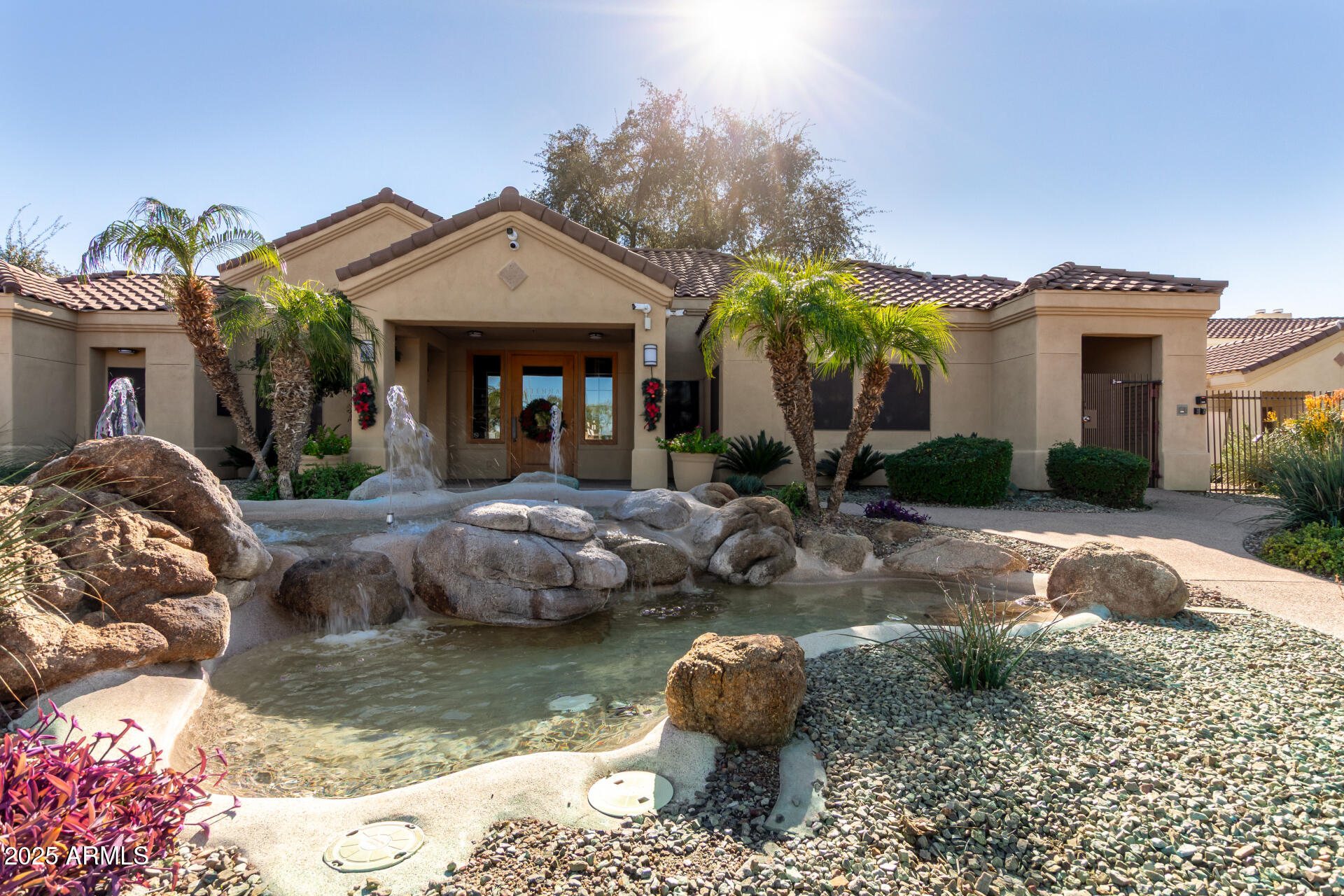 7575 East Indian Bend Road, Unit 2146 Scottsdale, AZ 85250 - Photo 30 of 40 a front view of a house with swimming pool and porch
