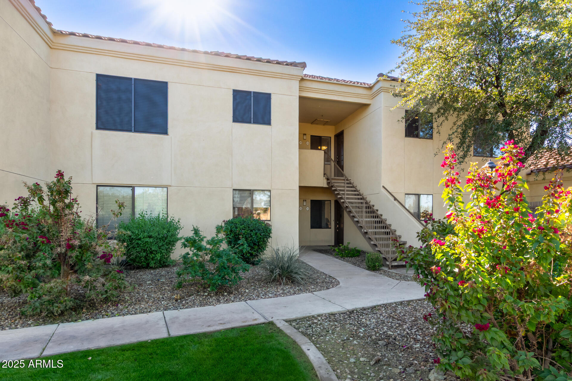 7575 East Indian Bend Road, Unit 2146 Scottsdale, AZ 85250 - Photo 36 of 40 a front view of a house with a yard