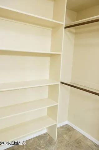 a view of an empty walk in closet