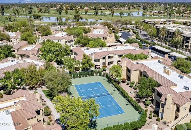 an aerial view of residential houses with outdoor space
