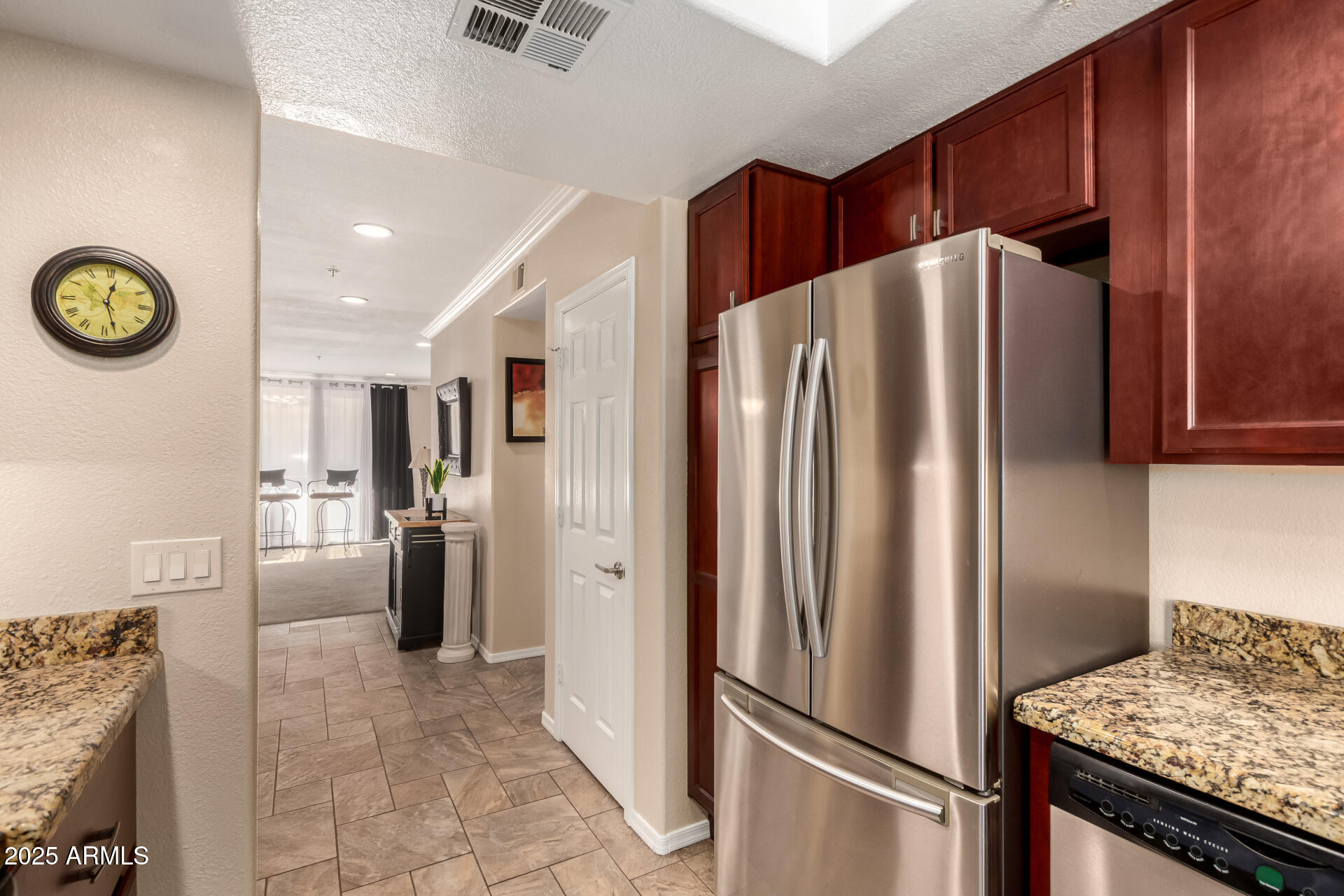 7575 East Indian Bend Road, Unit 2146 Scottsdale, AZ 85250 - Photo 9 of 40 a metallic refrigerator freezer sitting in a kitchen