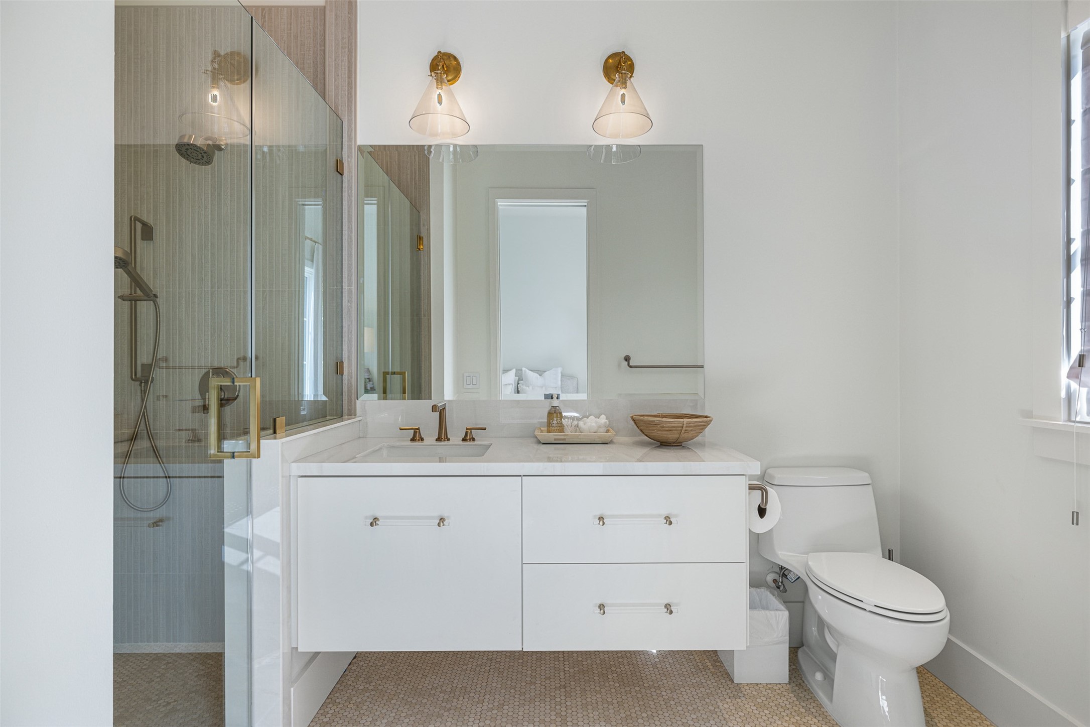 830 South Weyand Road Round Top, TX 78954 - Photo 13 of 35 a bathroom with a double vanity sink toilet and mirror